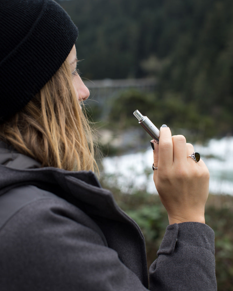 Linx-Hypnos Zero Concentrate Vaporizer is one of the best dab pens: held in hand by woman outdoors 