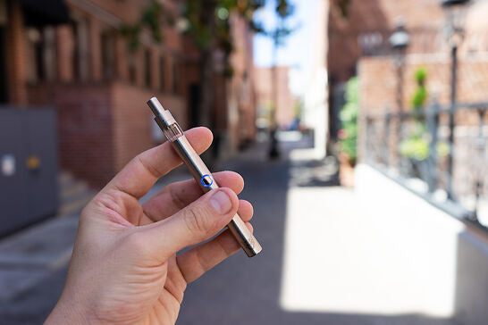 Hand holding Ember, one of the best dab pens